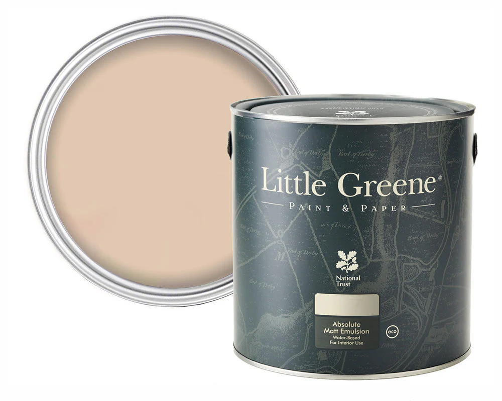 A tin of Little Greene paint with the lid off, showing a smooth, light beige paint inside. The tin has a dark label featuring a map-like design and the Little Greene and National Trust logos.